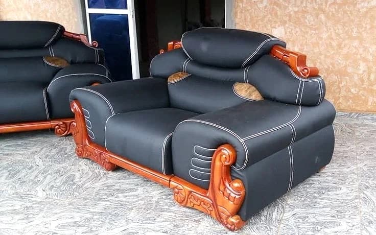 Black carved-timber armchair