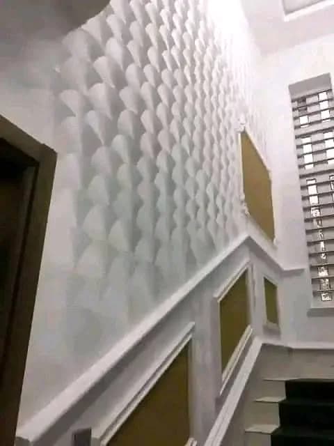 Sculpted white geometric wall